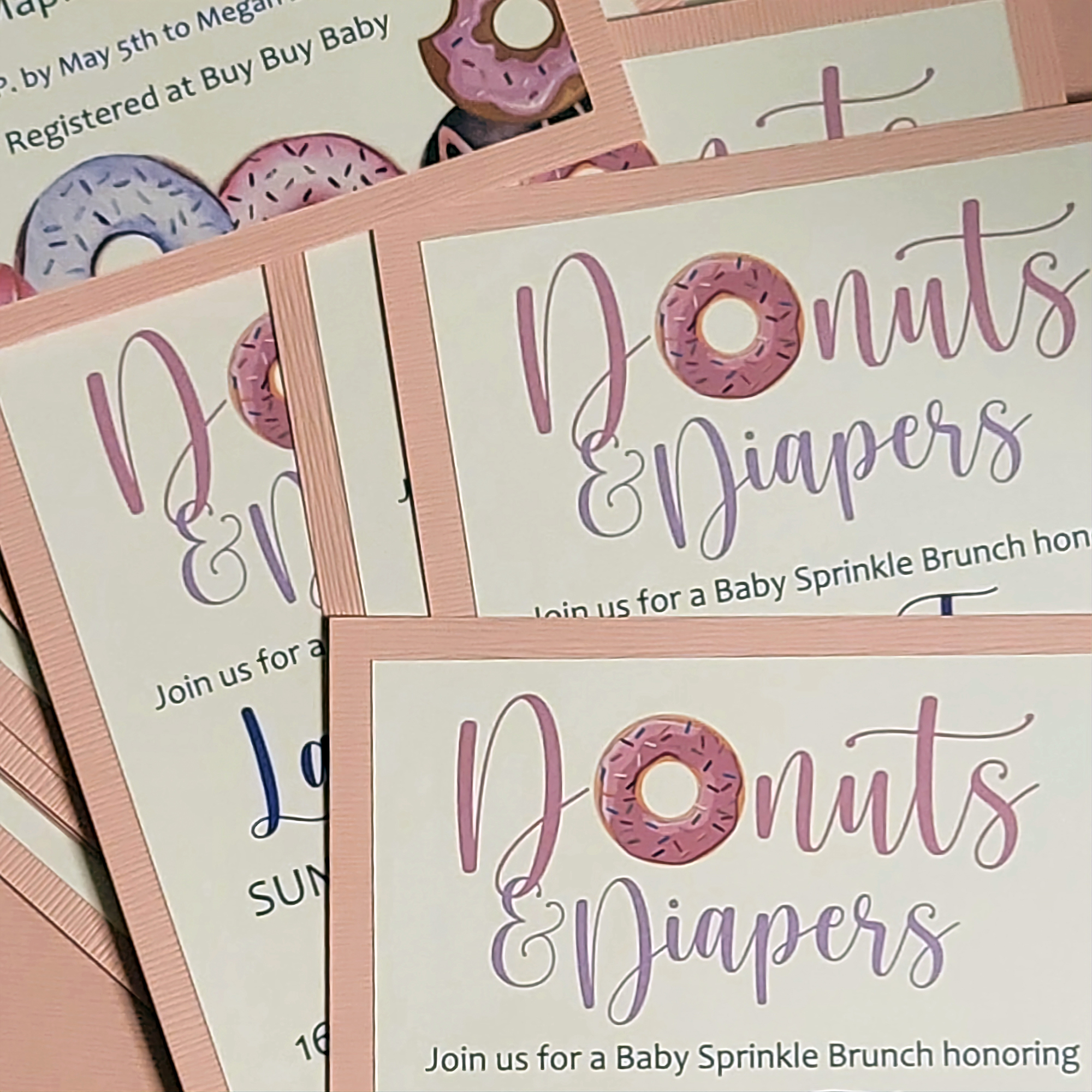 Baby shower invitations for a Donut and Diapers theme baby sprinkle for a girl.